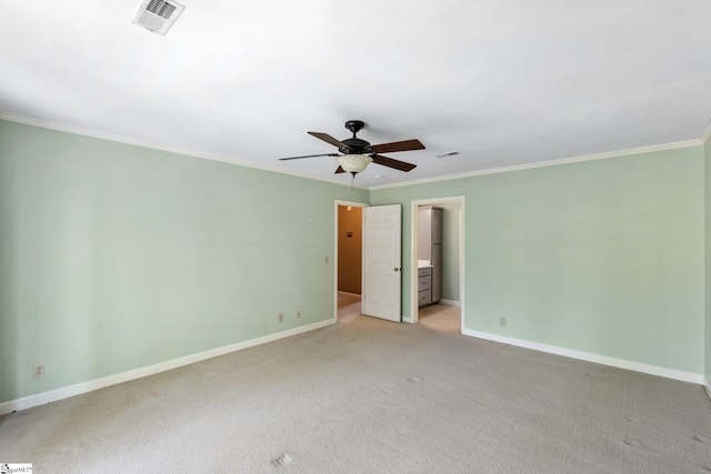 unfurnished bedroom with baseboards, ornamental molding, light carpet, a ceiling fan, and visible vents