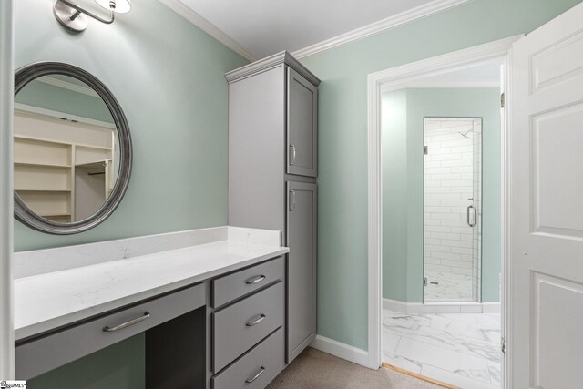 full bath featuring crown molding, a shower stall, vanity, marble finish floor, and baseboards