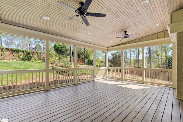 deck with fence, a yard, and a ceiling fan