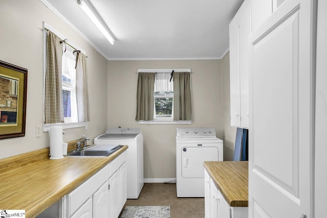 406 N Main St, Fountain Inn, SC 29644 - clothes washing area with washing machine and dryer, a sink, ornamental molding, and cabinet space