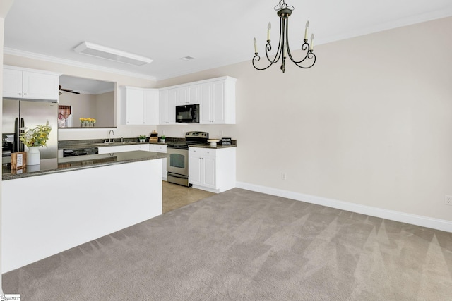 kitchen with dark countertops, a sink, light carpet, and stainless steel appliances