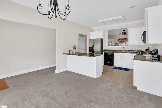 kitchen with visible vents, white cabinets, dark countertops, black appliances, and light colored carpet