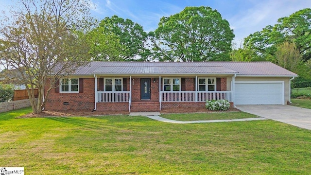 ranch-style home with brick siding, a porch, a garage, and a front lawn
