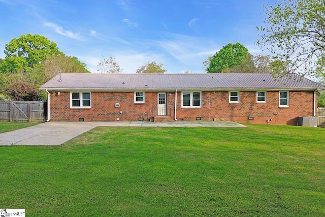 back of house with a patio, metal roof, crawl space, and fence