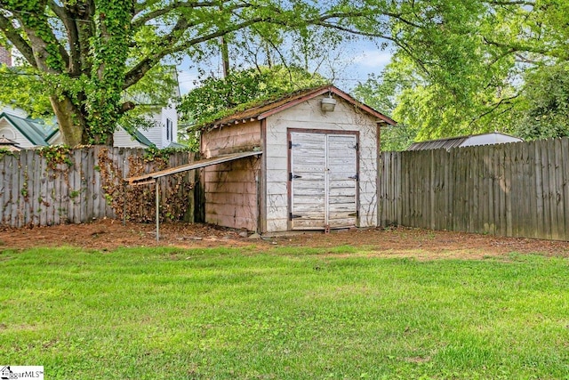 view of shed featuring a fenced backyard