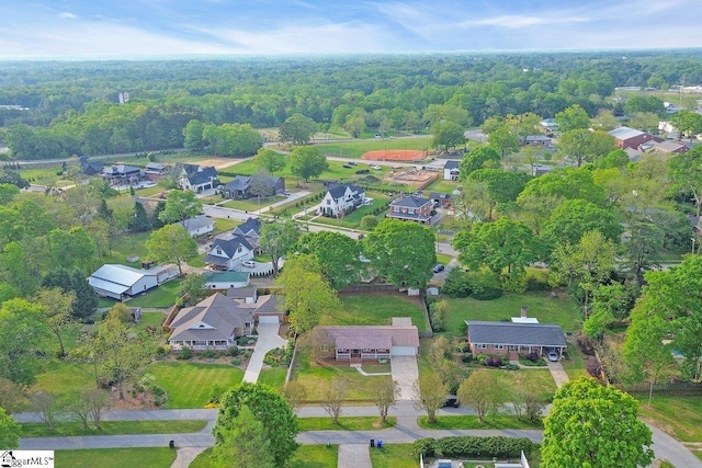 bird's eye view featuring a residential view and a view of trees