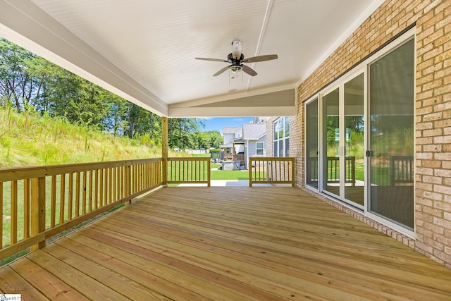 wooden deck featuring a ceiling fan