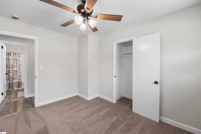 unfurnished bedroom featuring a closet, ceiling fan, baseboards, and carpet
