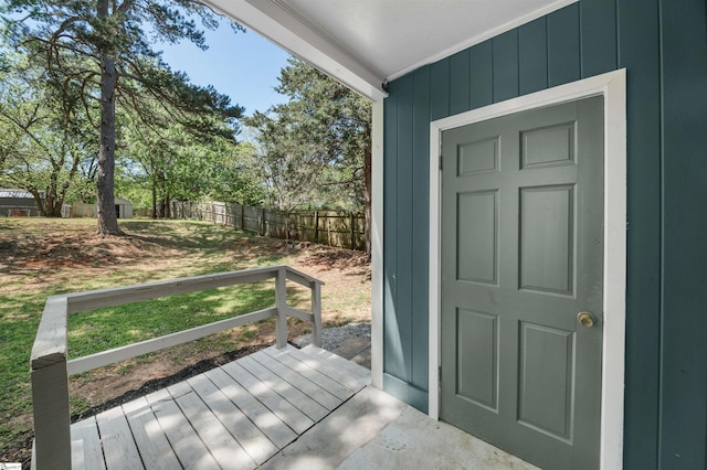exterior space featuring fence and a lawn