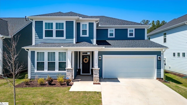 102 Moorish Cir, Simpsonville, SC 29681 - view of front of home featuring a front yard, an attached garage, driveway, and roof with shingles