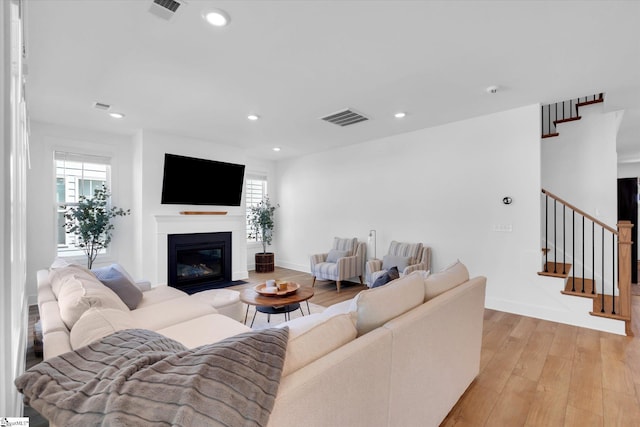 102 Moorish Cir, Simpsonville, SC 29681 - living area featuring visible vents, light wood-type flooring, and a healthy amount of sunlight