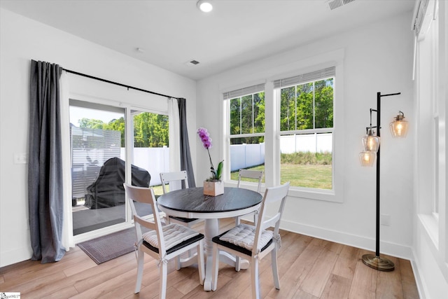 102 Moorish Cir, Simpsonville, SC 29681 - dining room with recessed lighting, light wood-style flooring, baseboards, and a healthy amount of sunlight