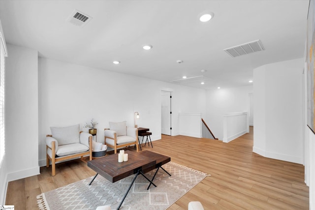 102 Moorish Cir, Simpsonville, SC 29681 - living area with light wood-type flooring, visible vents, and an upstairs landing