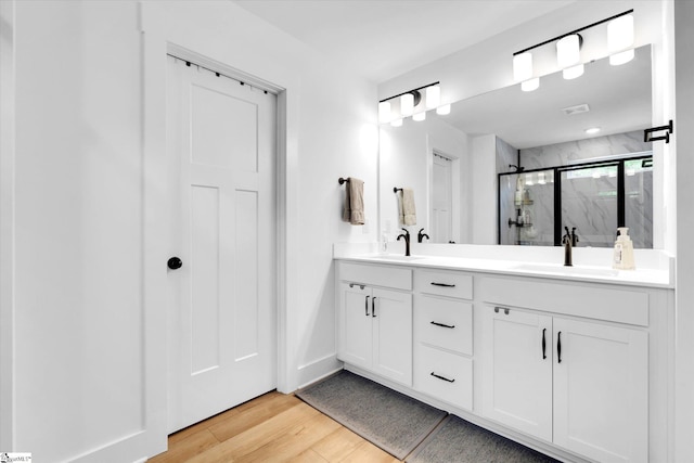 102 Moorish Cir, Simpsonville, SC 29681 - full bathroom featuring a sink, a marble finish shower, double vanity, and wood finished floors