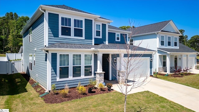 102 Moorish Cir, Simpsonville, SC 29681 - traditional-style house featuring an attached garage, fence, concrete driveway, a front lawn, and a gate