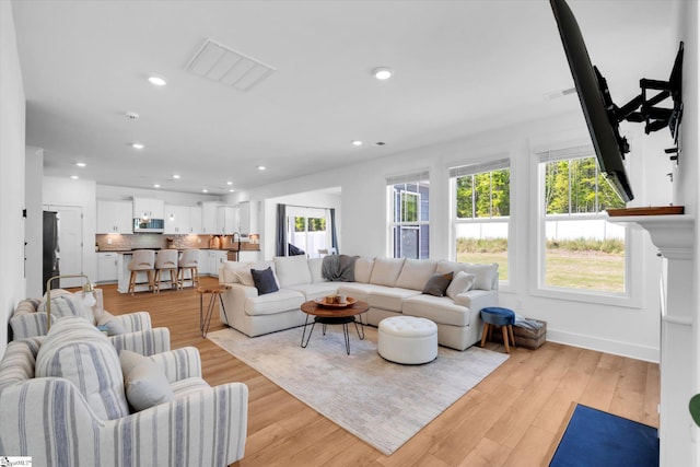102 Moorish Cir, Simpsonville, SC 29681 - living room featuring visible vents, light wood-style flooring, and recessed lighting