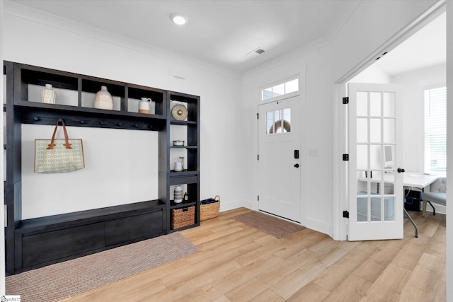 102 Moorish Cir, Simpsonville, SC 29681 - foyer with light wood-style floors, crown molding, and visible vents