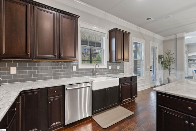 kitchen featuring stainless steel dishwasher, crown molding, a sink, dark brown cabinetry, and dark wood-type flooring