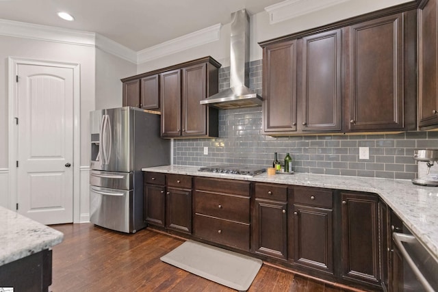 kitchen with wall chimney range hood, decorative backsplash, dark brown cabinetry, stainless steel appliances, and dark wood-style floors
