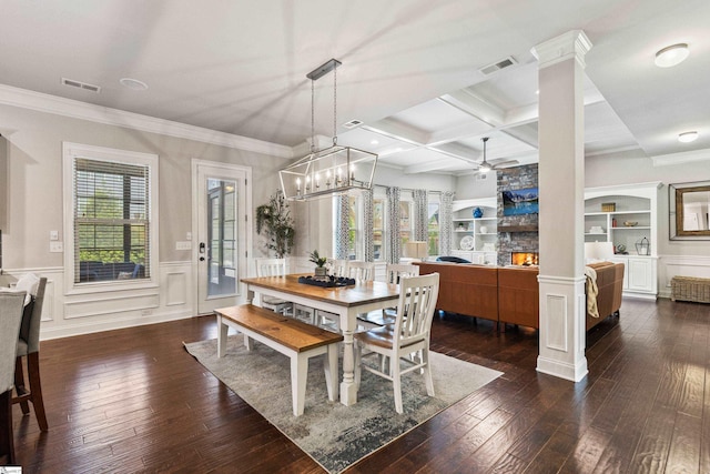 dining space featuring visible vents, hardwood / wood-style flooring, and ceiling fan with notable chandelier