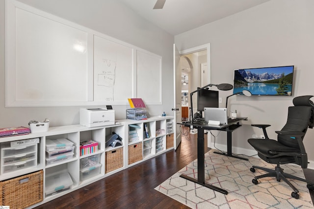 office with ceiling fan, arched walkways, wood finished floors, and baseboards