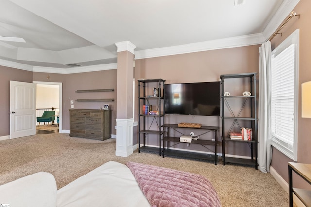 carpeted bedroom featuring baseboards, ornamental molding, and decorative columns