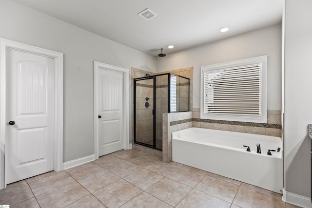 full bathroom featuring a garden tub, visible vents, tile patterned flooring, and a stall shower