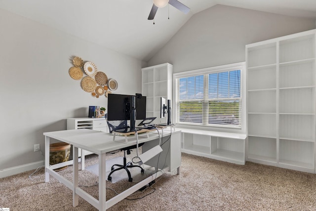 office featuring ceiling fan, vaulted ceiling, baseboards, and light colored carpet
