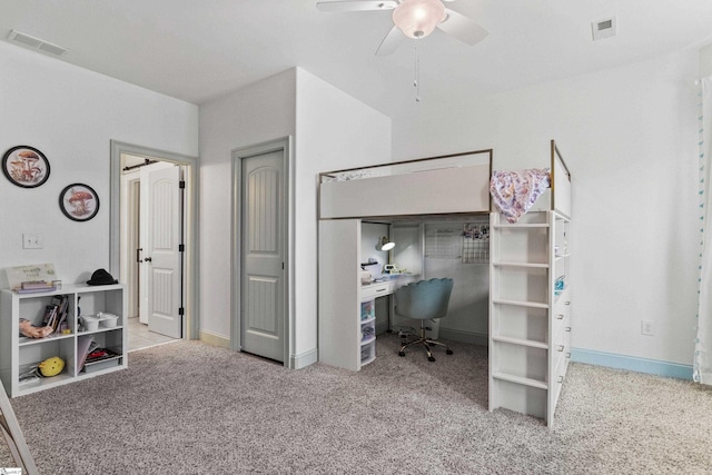 carpeted bedroom featuring baseboards, a ceiling fan, and visible vents
