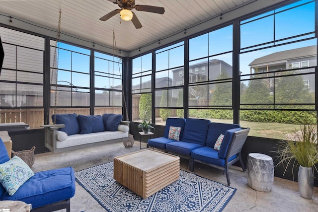 sunroom featuring ceiling fan and an outdoor hangout area