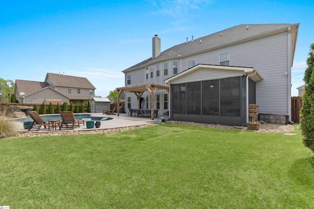 back of property with a chimney, a fenced in pool, a fenced backyard, a yard, and a sunroom