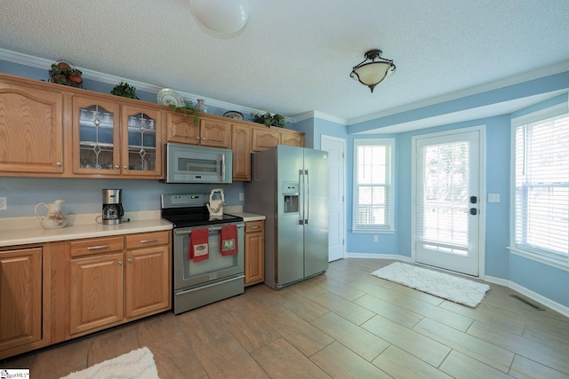 38 River Park Ln, Taylors, SC 29687 - kitchen with glass insert cabinets, appliances with stainless steel finishes, a textured ceiling, and light countertops