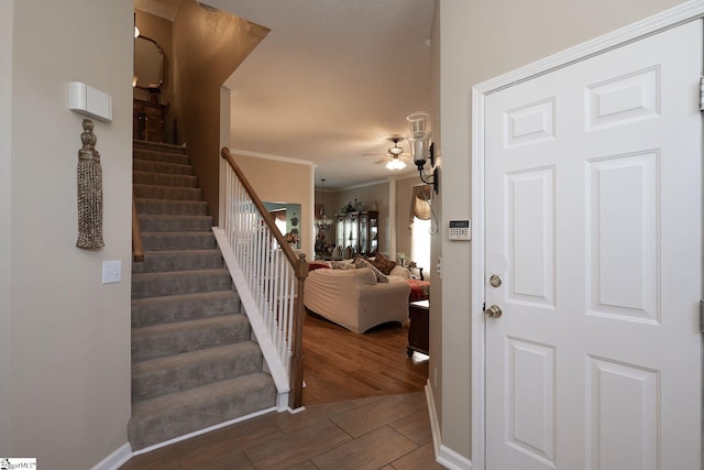 38 River Park Ln, Taylors, SC 29687 - foyer featuring crown molding, baseboards, a ceiling fan, and stairs