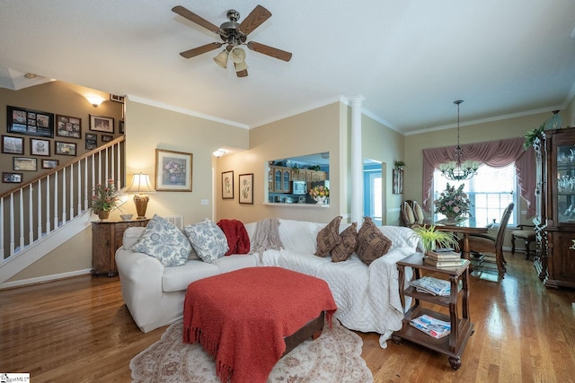 38 River Park Ln, Taylors, SC 29687 - living area featuring stairway, ornamental molding, wood finished floors, and ceiling fan with notable chandelier