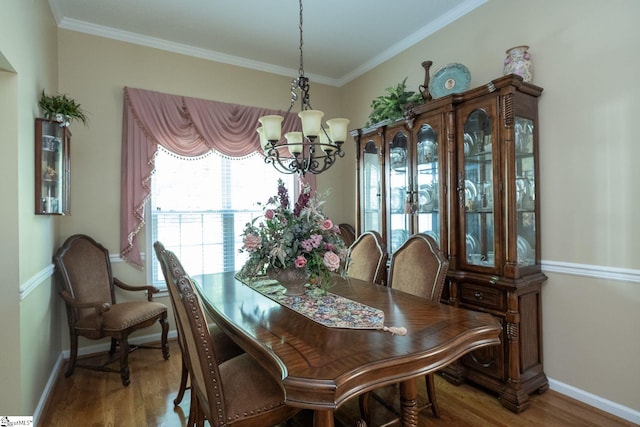 38 River Park Ln, Taylors, SC 29687 - dining space featuring crown molding, baseboards, a notable chandelier, and wood finished floors