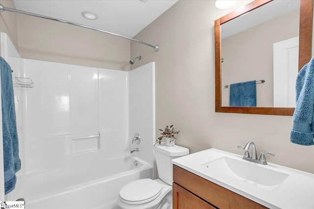 full bath featuring bathing tub / shower combination, vanity, and toilet