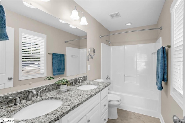 full bathroom featuring bathtub / shower combination, tile patterned floors, a sink, and visible vents