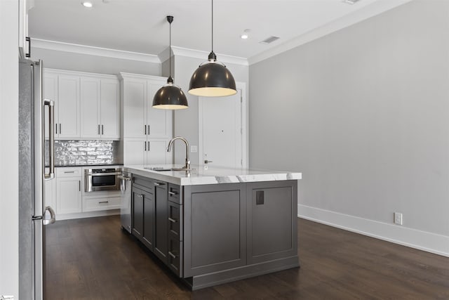 110 N Markley St Unit 304, Greenville, SC 29601 - kitchen featuring white cabinets, appliances with stainless steel finishes, dark wood-style floors, and a sink
