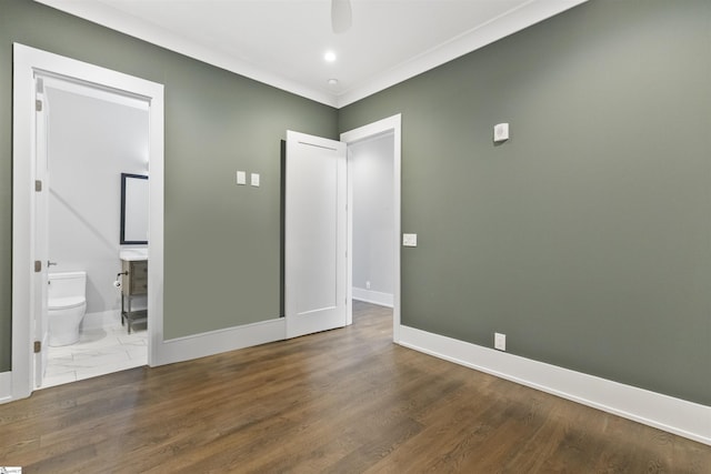110 N Markley St Unit 304, Greenville, SC 29601 - unfurnished bedroom featuring wood finished floors, a ceiling fan, baseboards, and connected bathroom