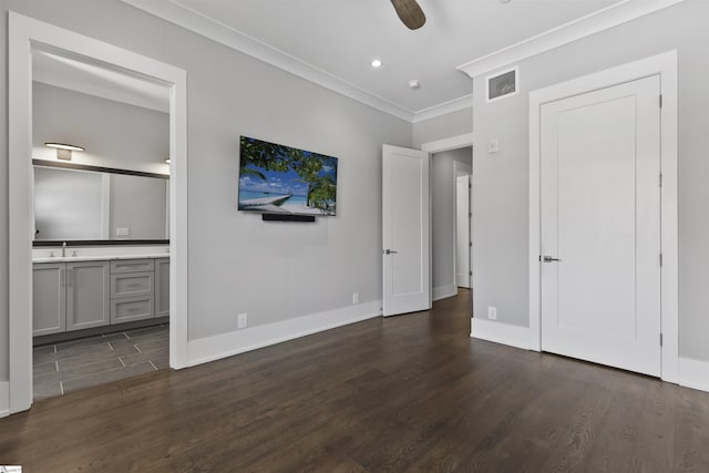110 N Markley St Unit 304, Greenville, SC 29601 - unfurnished bedroom featuring baseboards, visible vents, connected bathroom, dark wood-type flooring, and ornamental molding