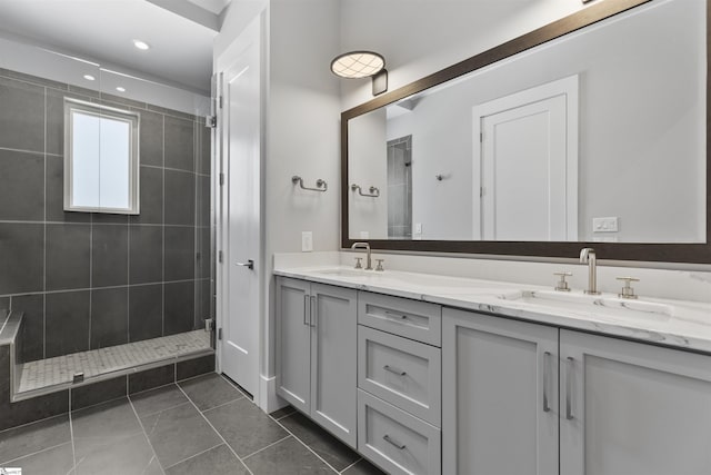 110 N Markley St Unit 304, Greenville, SC 29601 - full bathroom with tile patterned flooring, a sink, double vanity, and a tile shower