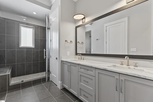 110 N Markley St Unit 304, Greenville, SC 29601 - bathroom with double vanity, tile patterned flooring, tiled shower, and a sink