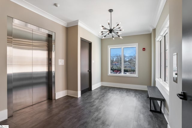 110 N Markley St Unit 304, Greenville, SC 29601 - foyer entrance with baseboards, elevator, a chandelier, and ornamental molding