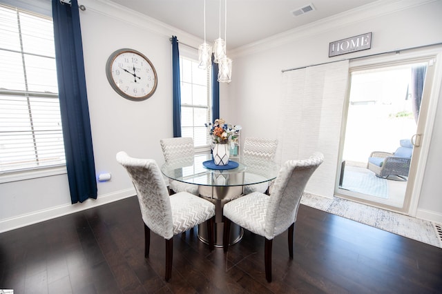dining room featuring ornamental molding, baseboards, a notable chandelier, dark wood-type flooring, and visible vents