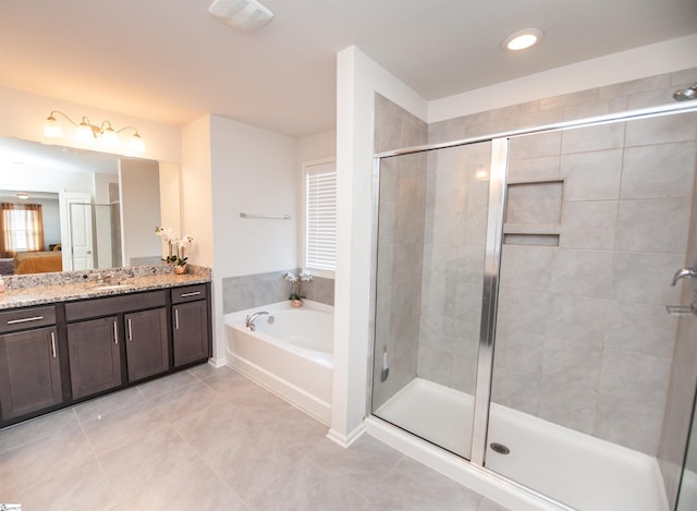 full bath with a shower stall, tile patterned flooring, visible vents, vanity, and a garden tub