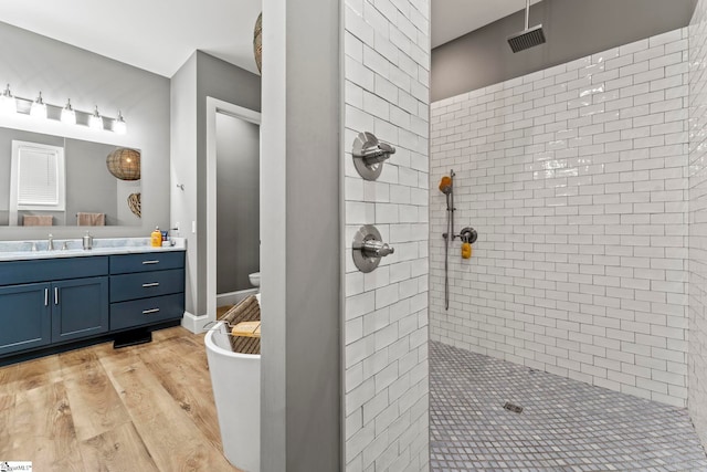 1359 Martin Creek Rd, Seneca, SC 29678 - bathroom featuring toilet, wood finished floors, vanity, and a tile shower