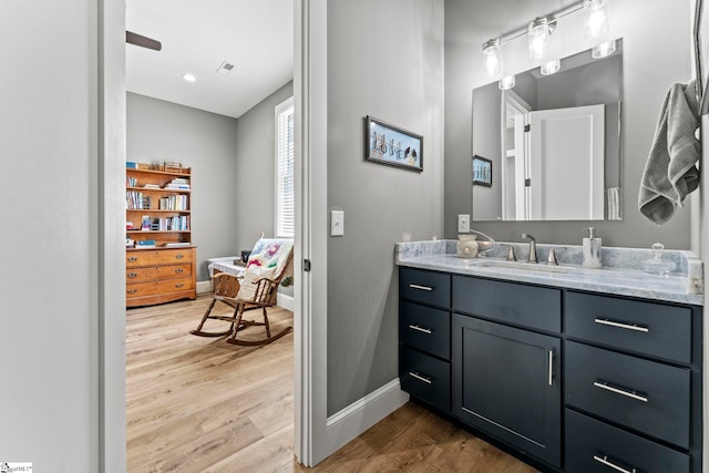 1359 Martin Creek Rd, Seneca, SC 29678 - bathroom with baseboards, vanity, wood finished floors, and visible vents