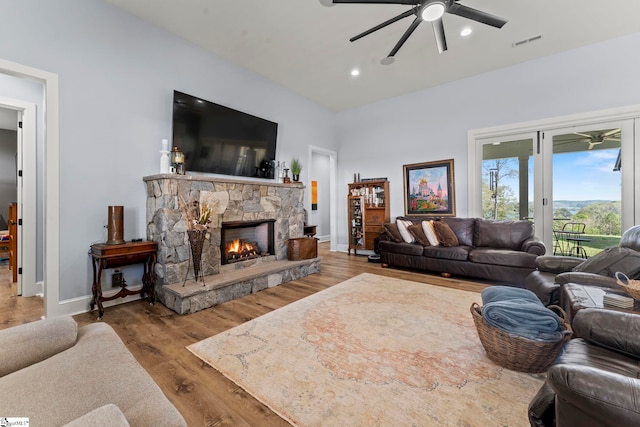 1359 Martin Creek Rd, Seneca, SC 29678 - living area featuring baseboards, a ceiling fan, a stone fireplace, and visible vents