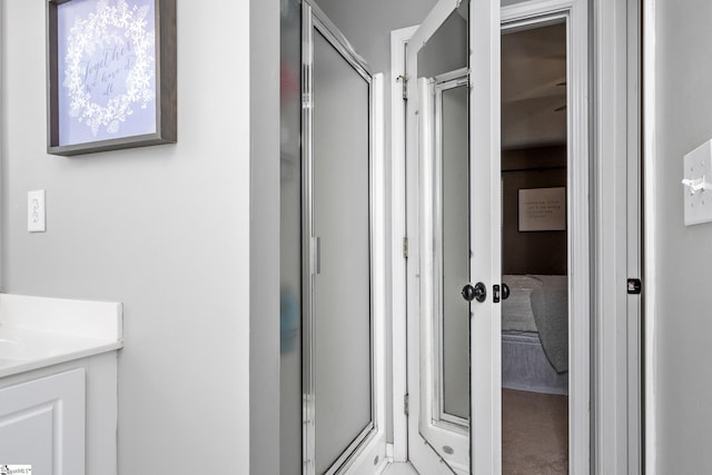 bathroom with vanity and a stall shower