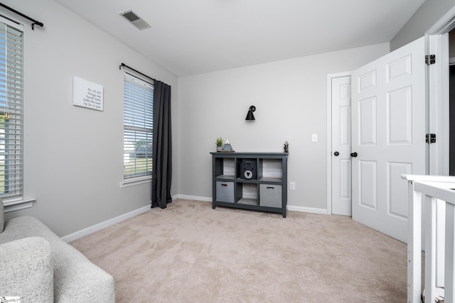 bedroom with visible vents, carpet flooring, and baseboards